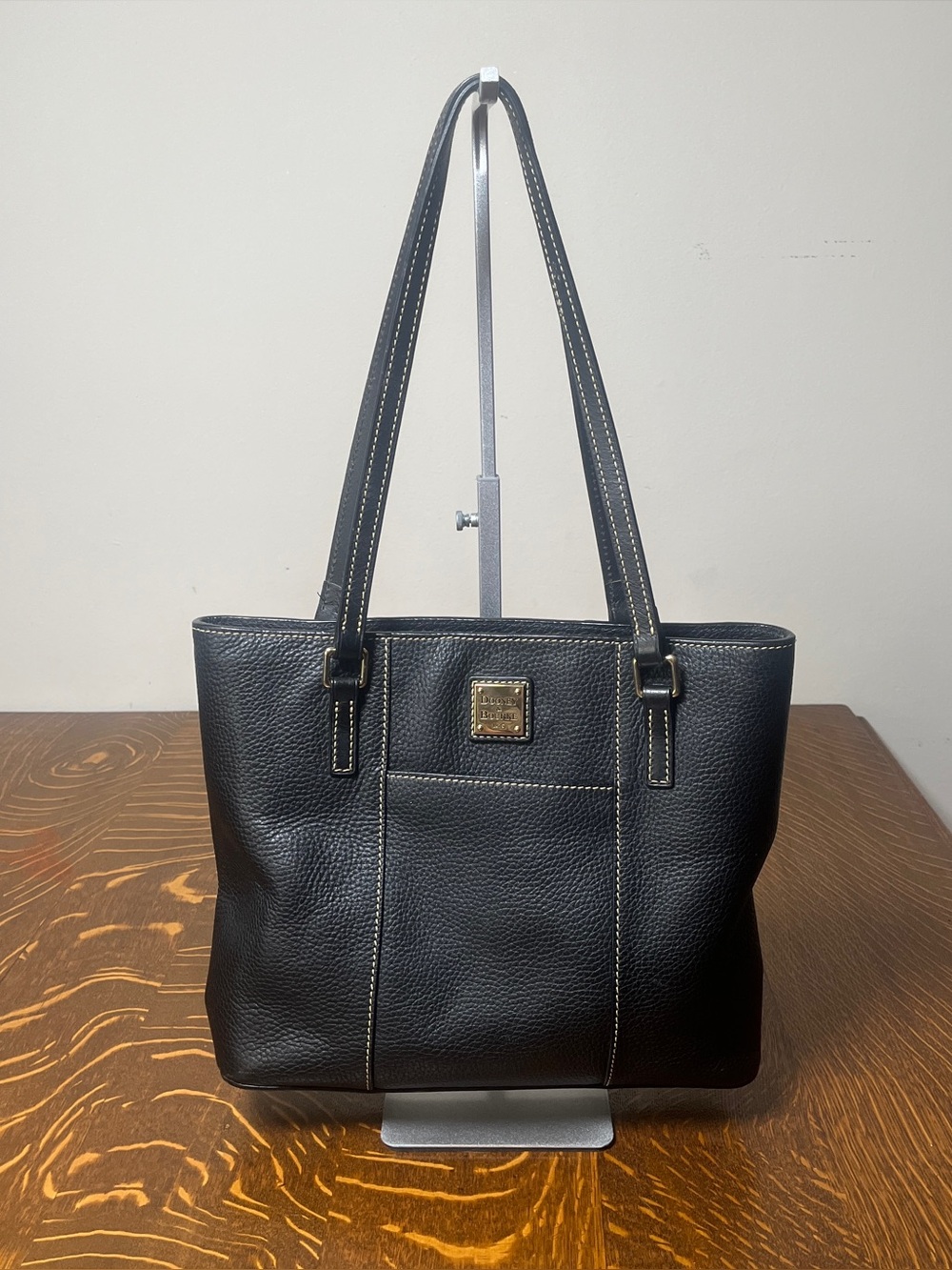 Dooney & Bourke Black Pebbled Leather Lexington Shoulder Tote with gold tone.